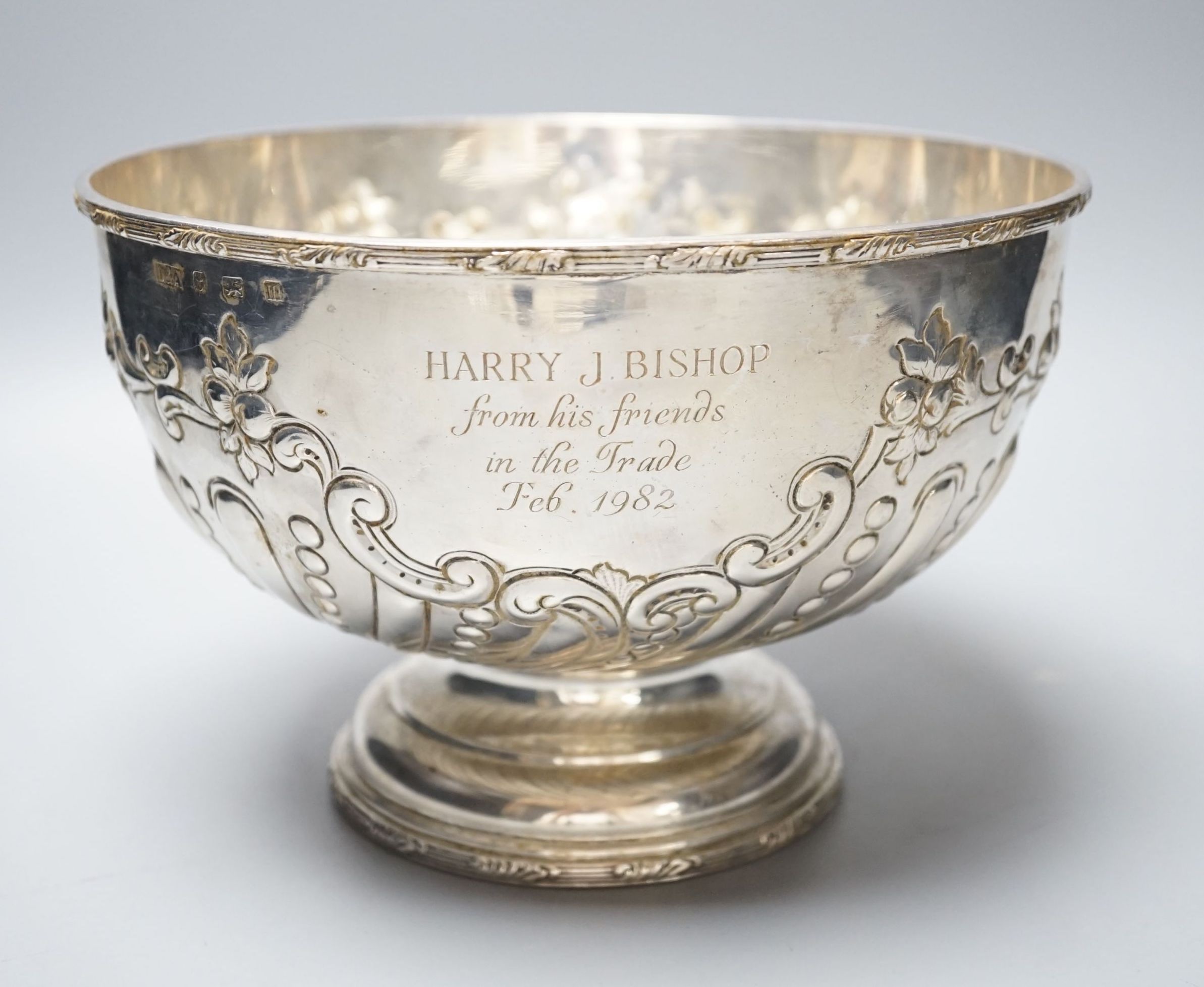 A George V embossed silver rose bowl, with later engraved inscription, Daniel & Arter, Birmingham, 1911, 22.5cm, 25oz.